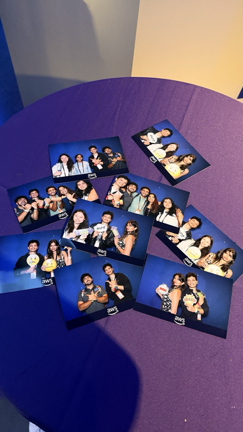 AWS photo booth prints on a purple table