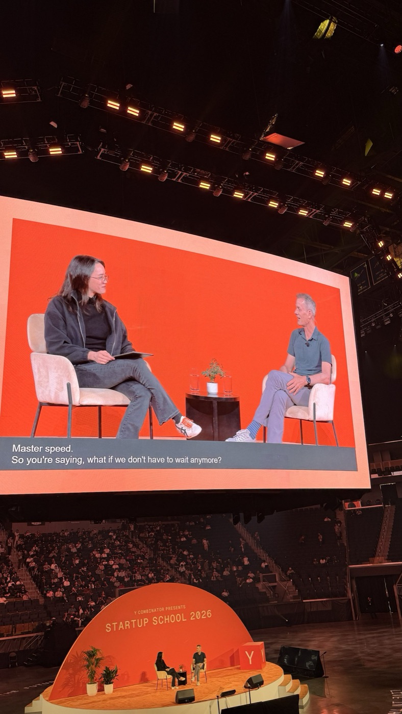 Big screen with the caption Master speed above the Startup School 2026 stage and the arena