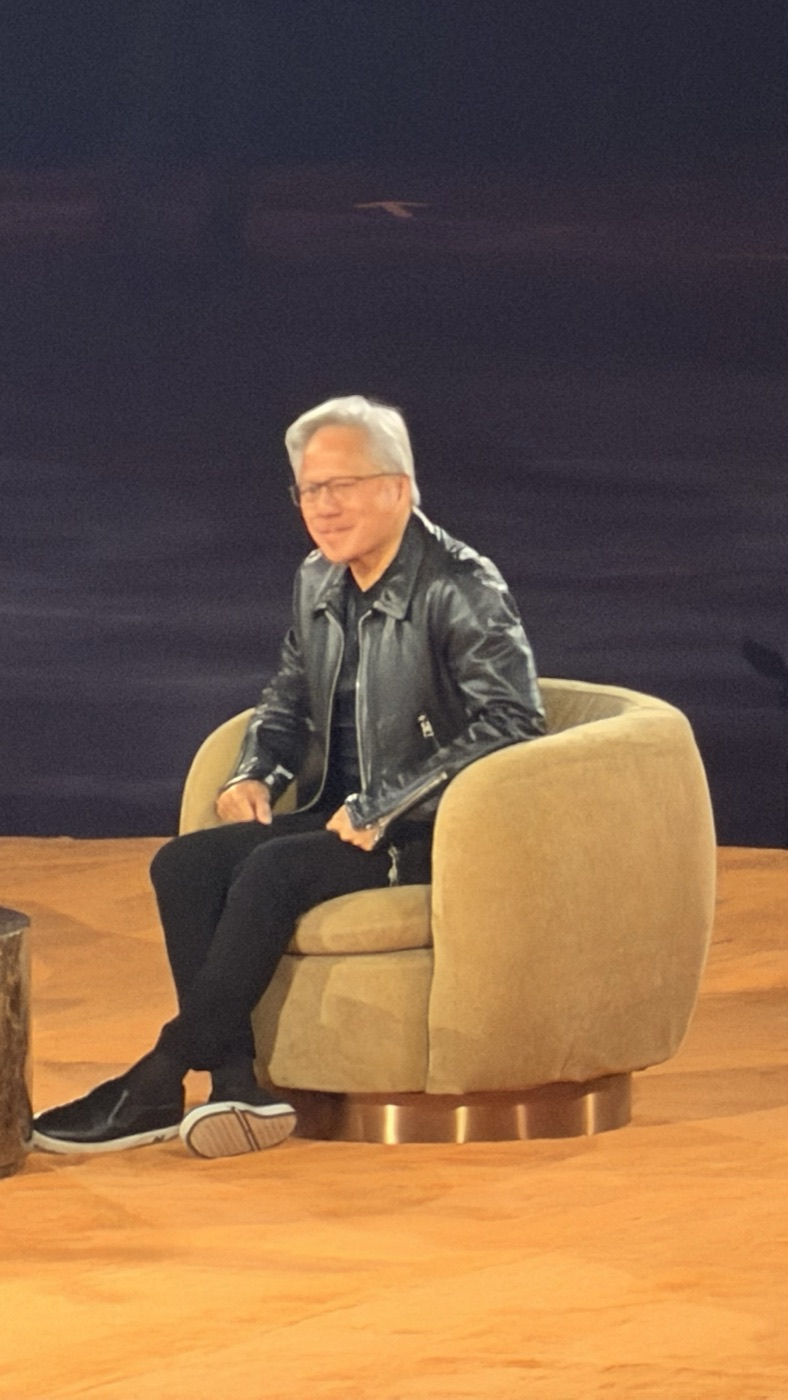 Jensen Huang in his leather jacket in the armchair on the Center Court stage